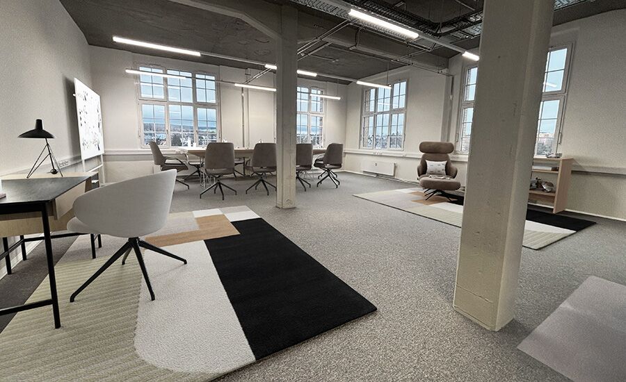 Ein modernes Büro mit stilvollen Möbeln, einem offenen Layout und einer minimalistischen Gestaltung